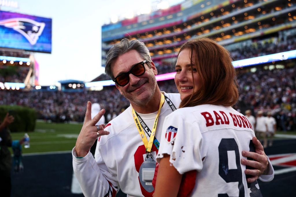 Jon Hamm and Anna Osceola on the sideline before Bad Bunny performs in the Apple Music Halftime Show during the NFL Super Bowl 60 football game between the Seattle Seahawks and the New England Patriots, at Levi's Stadium on February 8, 2026 in Santa Clara, California
