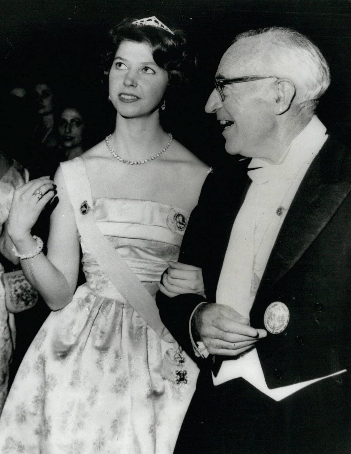 Princess Désirée of Sweden walks with Sir John Eccles, the Australian Nobel Prize winner for medicine, at the Nobel Prize banquet in Stockholm on December 10, 1963 (Keystone Press/Alamy)