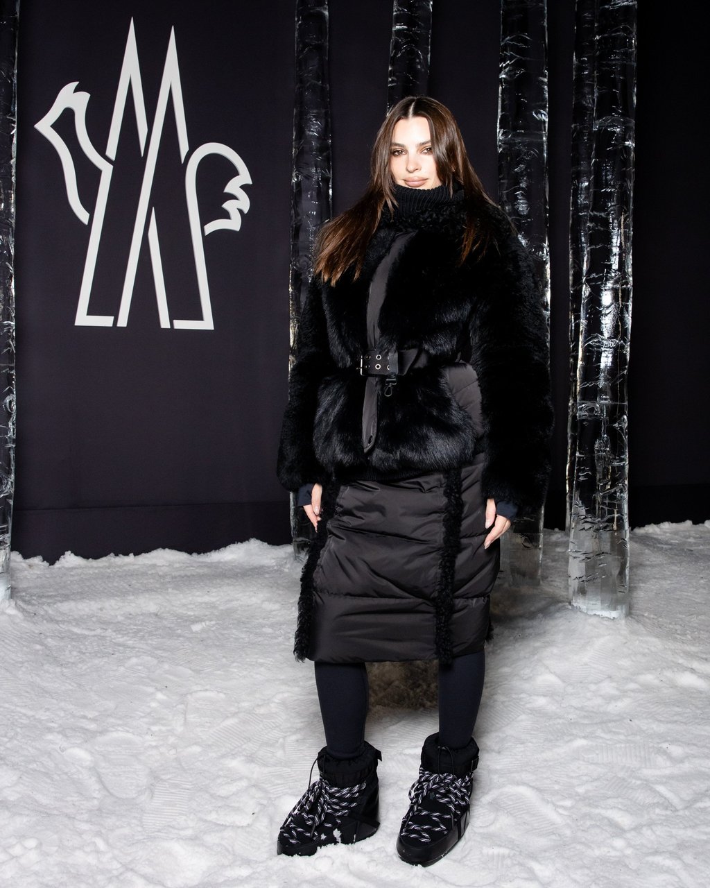 Model Emily Ratajkowski kept warm in an all-black outfit. Photo: Handout