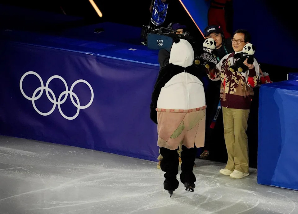 Mikhail Shaidorov of Kazakhstan greets Jackie Chan after performing in the figure skating exhibition gala during the Milano Cortina 2026 Olympic Winter Games at Milano Ice Skating Arena on Feb 21, 2026.