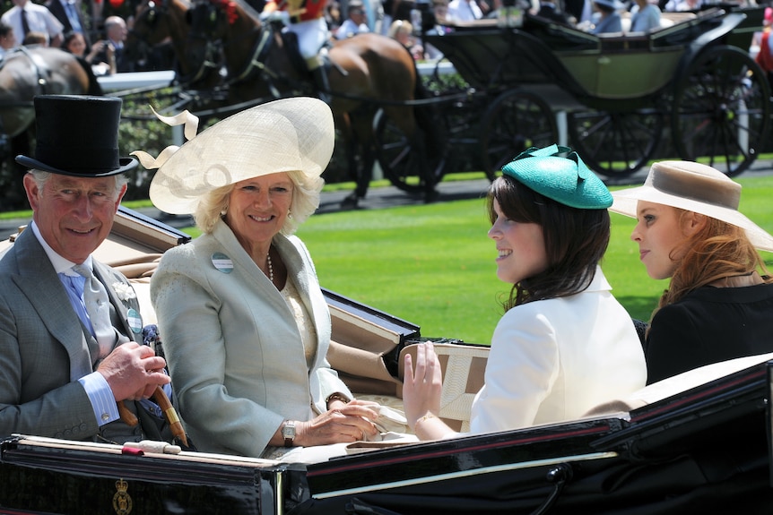 A photo of Charles, Camilla, Beatrice and Eugenie inside an open carriage at the Royal Ascot.