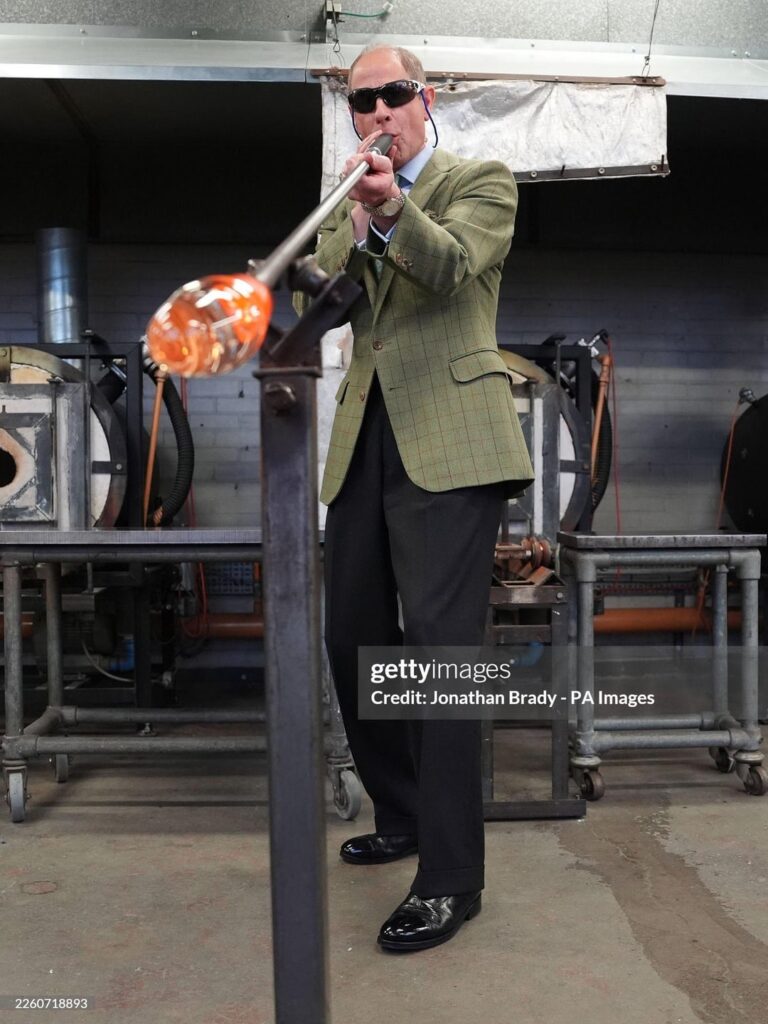 Duke of Edinburgh tries glass blowing during appearance at University of the Creative Arts in Farnham