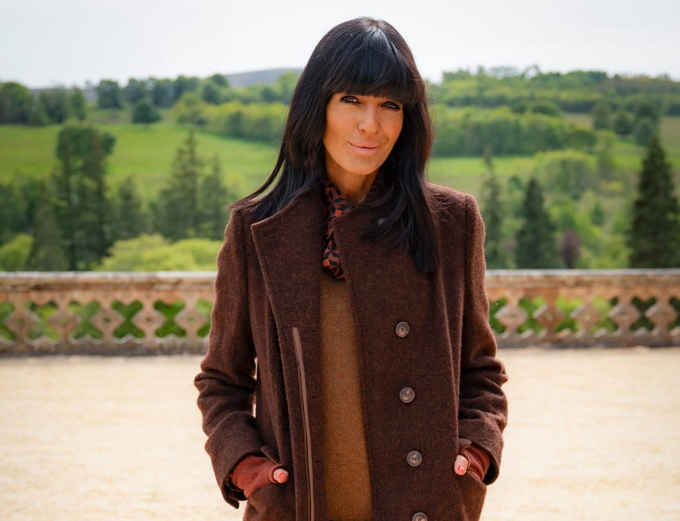 Claudia Winkleman The Traitors claudia winkleman standing in the castle grounds on the traitors