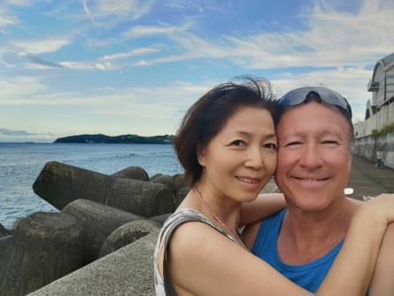 Hitomi and Kerry Cox pose for a selfie near the seaside in Yugawara, Japan.