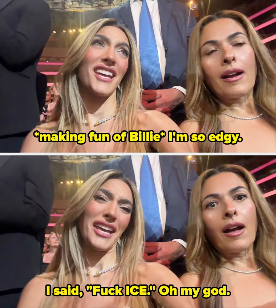 Two women at an indoor event, both wearing elegant strapless dresses and necklaces, looking animated and engaged in the moment