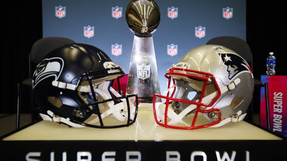 SAN JOSE, CALIFORNIA - FEBRUARY 02:The Vince Lombardi Trophy is framed by the Seattle Seahawks and New England Patriots  helmets during Super Bowl LX Opening Night at San Jose McEnery Convention Center on February 02, 2026 in San Jose, California. (Photo by Chris Graythen/Getty Images)