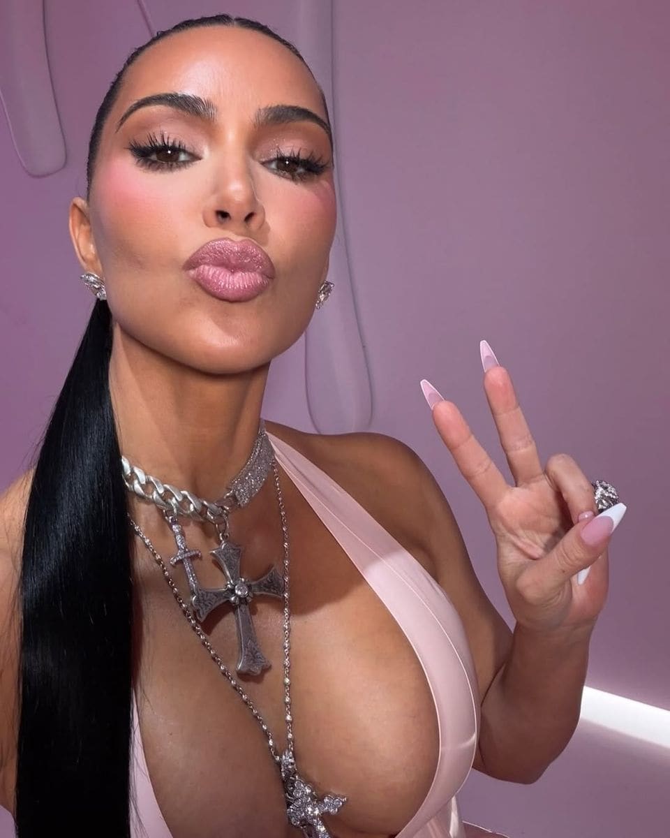 Kim Kardashian defies December chill in leopard print bikini selfie
