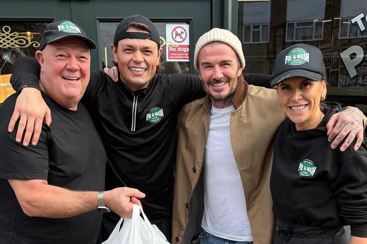 David Beckham (2nd from right) poses with people outside Tony's in Waltham Abbey