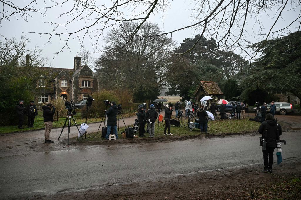 Members of the media stake out an entrance to Wood Farm on the royal family's Sandringham Estate in Norfolk