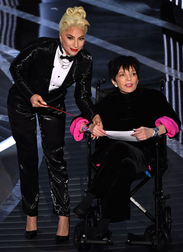 In her new memoir, Liza Minnelli (right) says she was "inexplicably ordered — not even asked — to sit in a wheelchair" when she appeared beside Lady Gaga at the 2022 Academy Awards. 