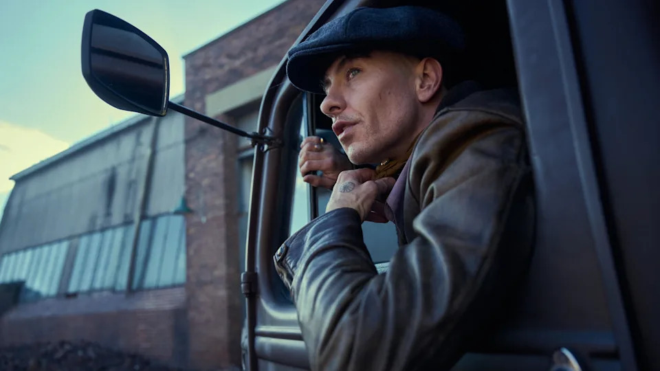 Barry Keoghan leaning out of a truck window in a scene from The Immortal Man