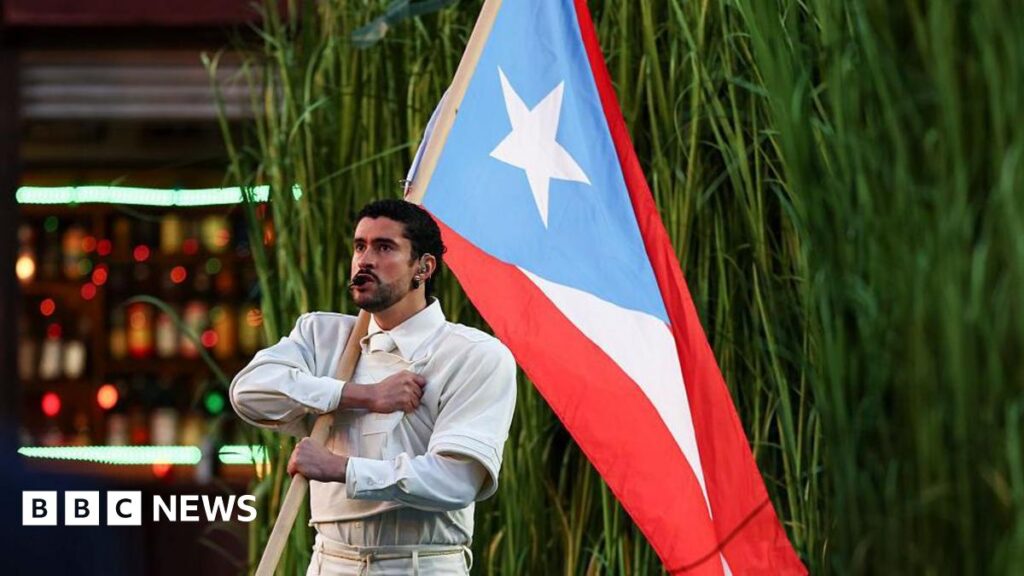 Bad Bunny performs with Puerto Rico's flag during the halftime in the Apple Music Halftime Show during the Super Bowl halftime at Levi's Stadium in Santa Clara, California. Photo: 8 February 2026