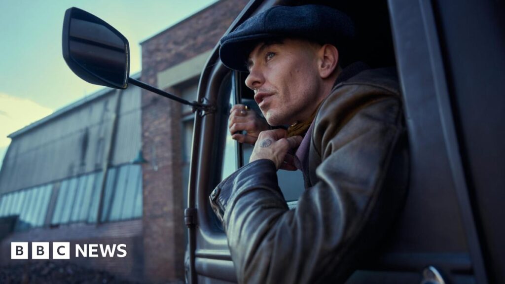 Peaky Blinders: What we learned from the first trailer for new film The Immortal Man Barry Keoghan and Cillian Murphy facing each other across a table or bar in a scene from the film