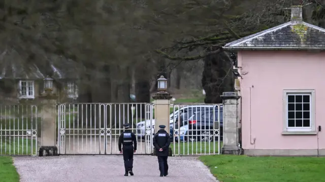 Two police officers outside the Royal Lodge