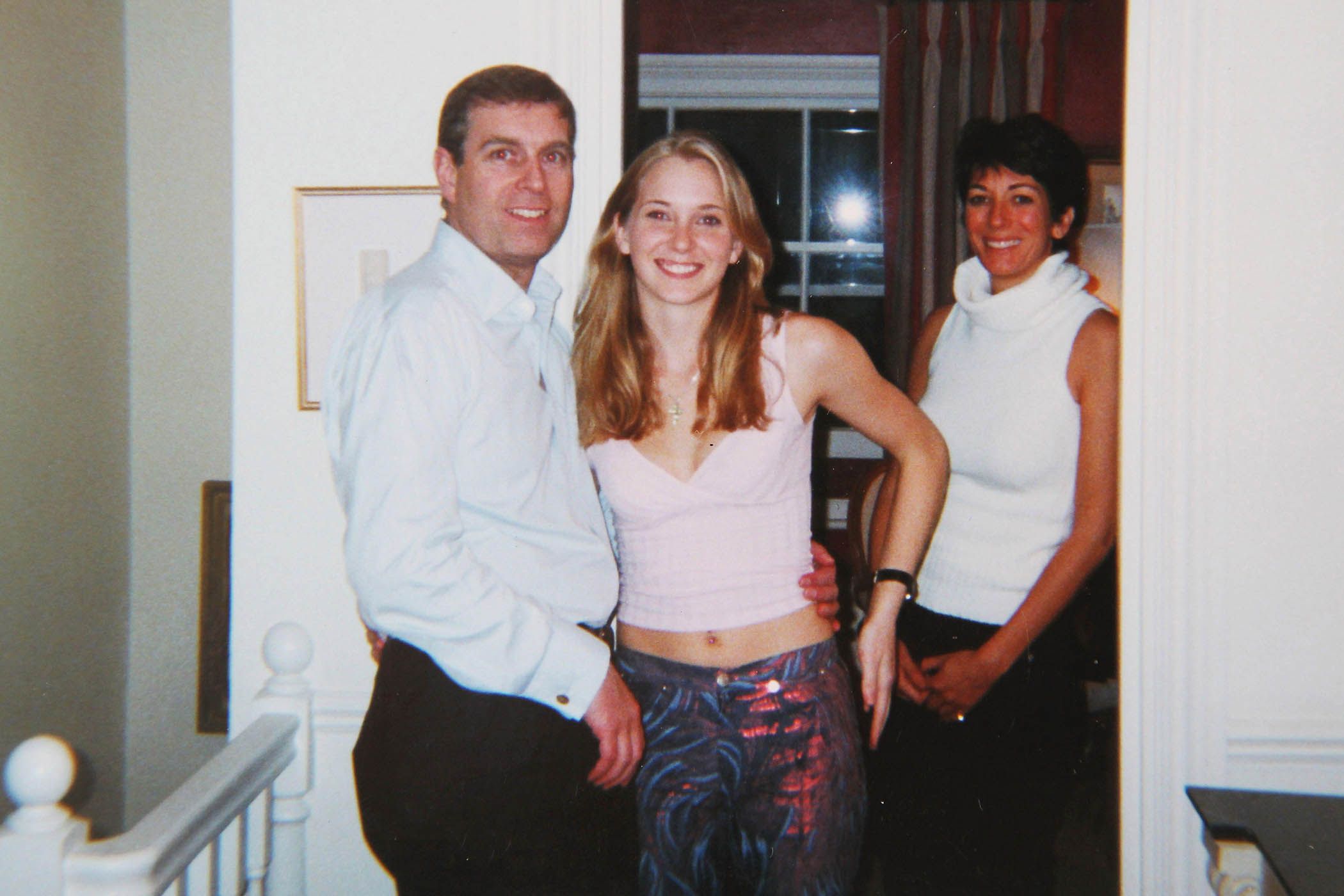 Prince Andrew with Virginia Roberts (later, Virginia Giuffre) and Ghislaine Maxwell, 2001