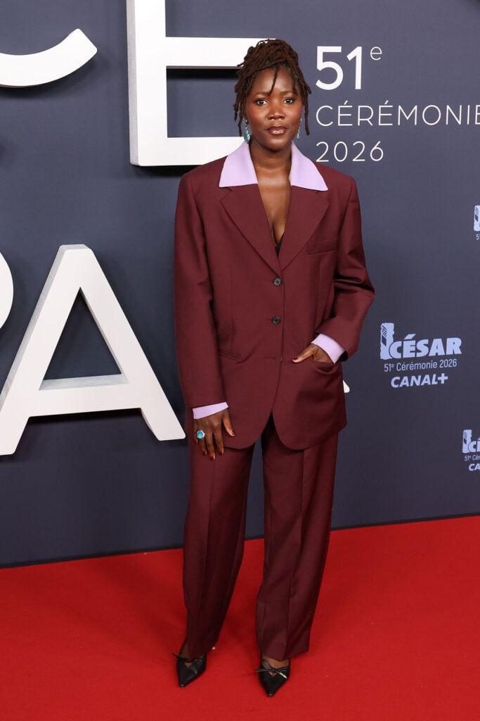 Alice Diop César Awards 2026, Miu Miu Spring 2025 suit, burgundy red carpet suit, Miu Miu tailoring 2025, César Awards 2026 fashion