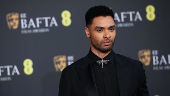 Rege-Jean Page added a pop of whimsy to his suit with a dragonfly collarbutton. (REUTERS)