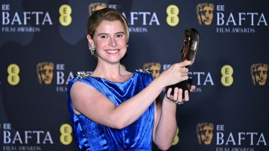 Irish actress Jessie Buckley poses with the award for Best Leading Actress in the film "Hamnet".She wore a light blue, silky gown that made her stylish presence memorable at the award show. (AFP)