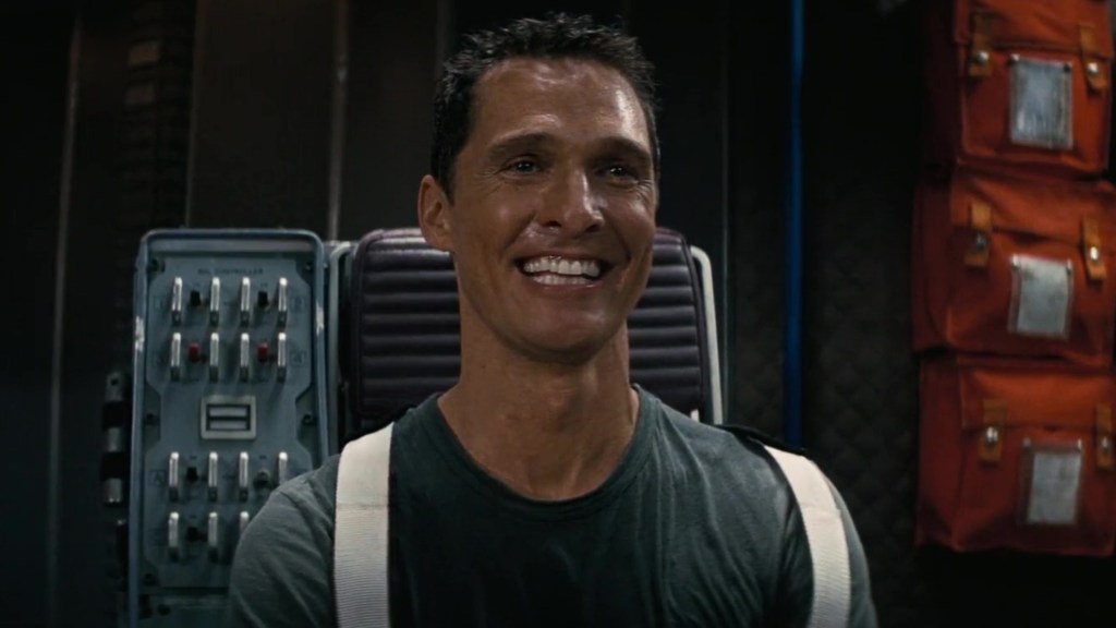 Coop (Matthew McConaughey) watching home videos in Interstellar