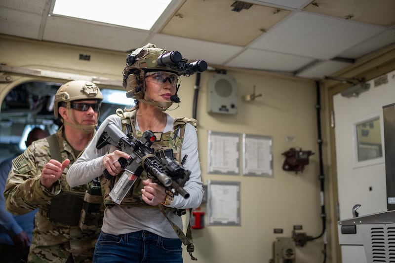 Department of Homeland Security Secretary Kristi Noem is guided by a member of Maritime Security Response Team West in San Diego, Calif., March 16, 2025. Noem visited Coast Guard Cutter Elm (WLB-204) to be a part of a MSRT-W training operation during a visit to the southwest border.