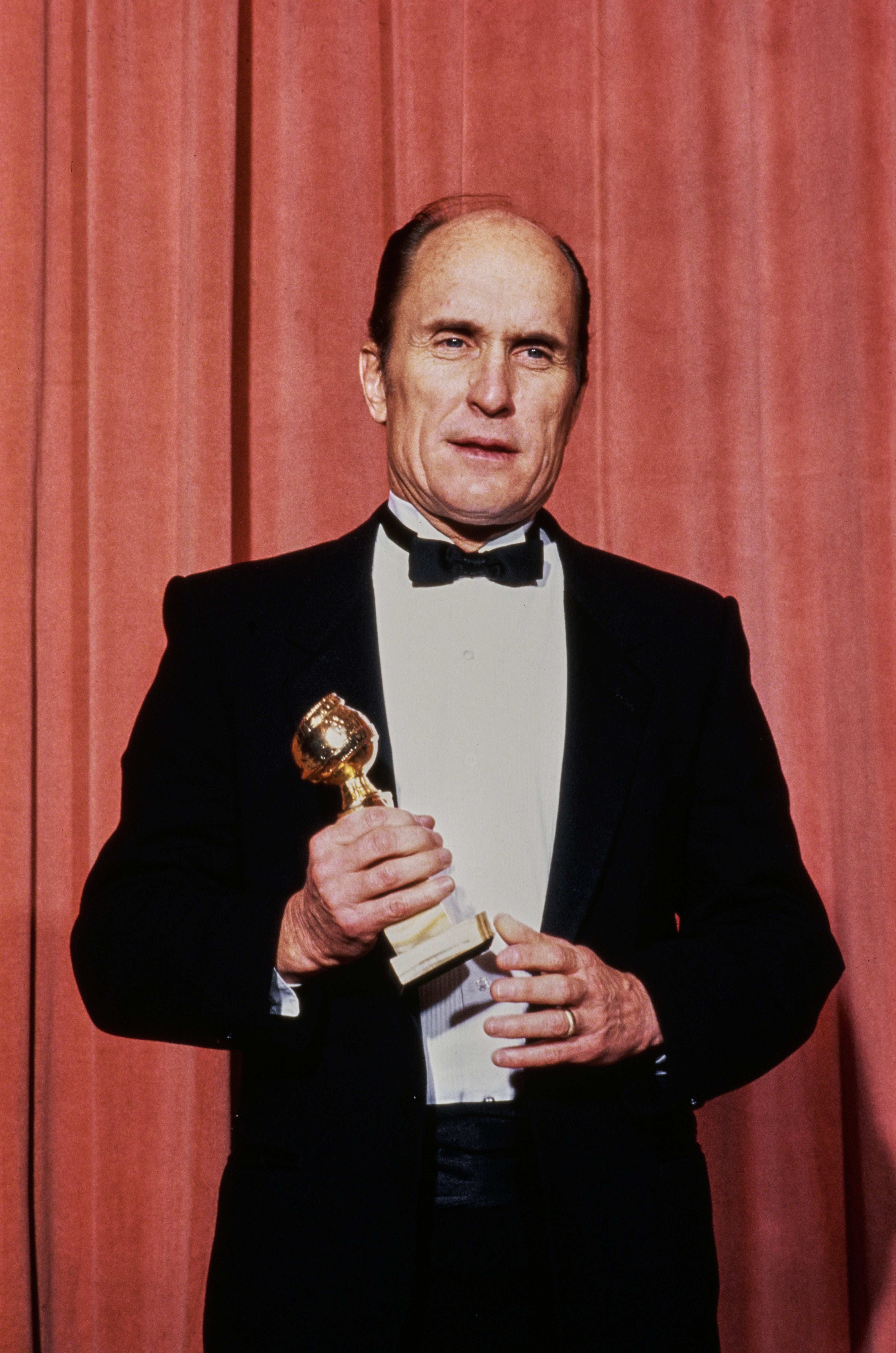 Robert Duvall with his Golden Globe for playing a country singer in 'Tender Mercies' in 1984