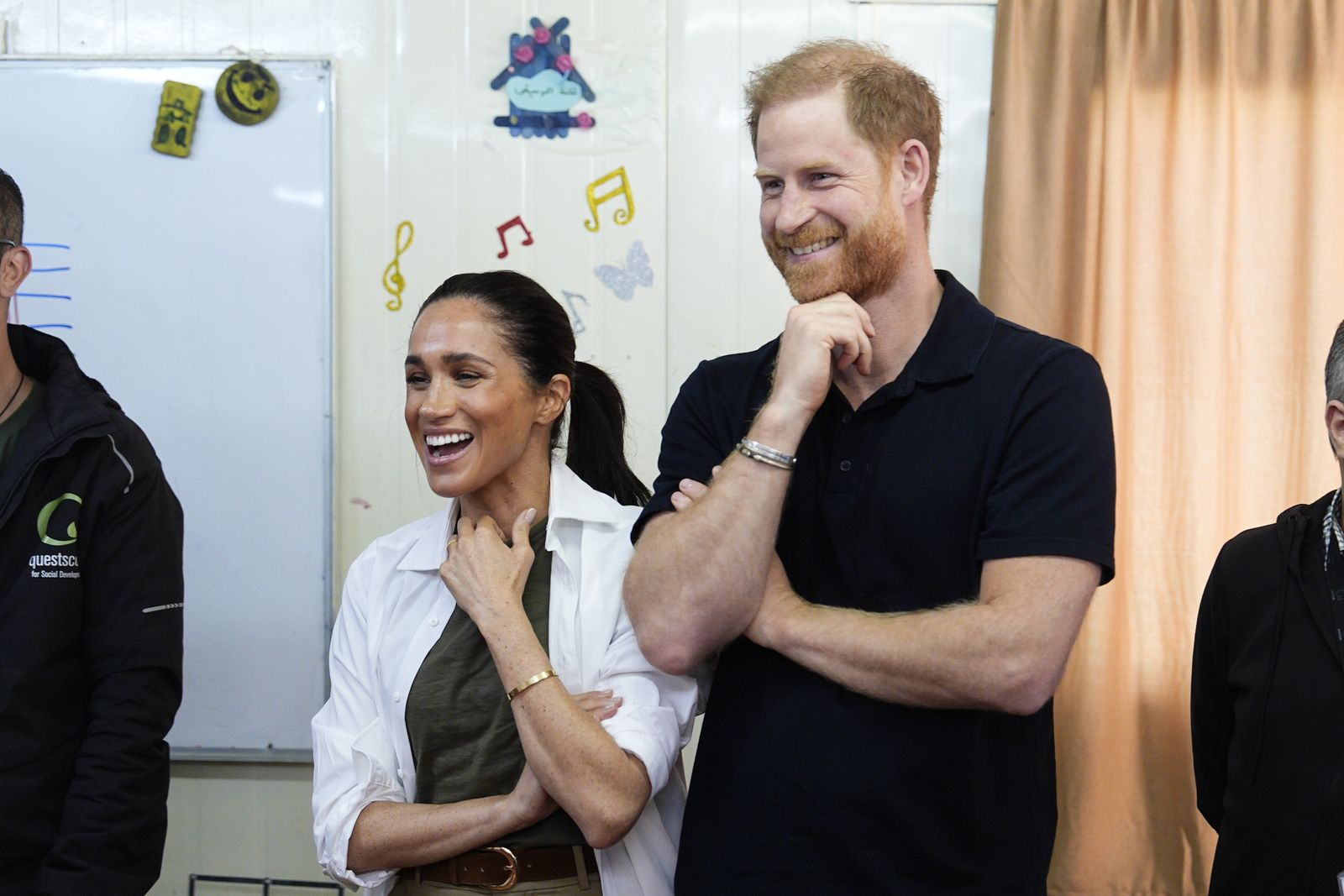 Image may contain Prince Harry Duke of Sussex Meghan Duchess of Sussex Face Head Person Happy Laughing and Adult