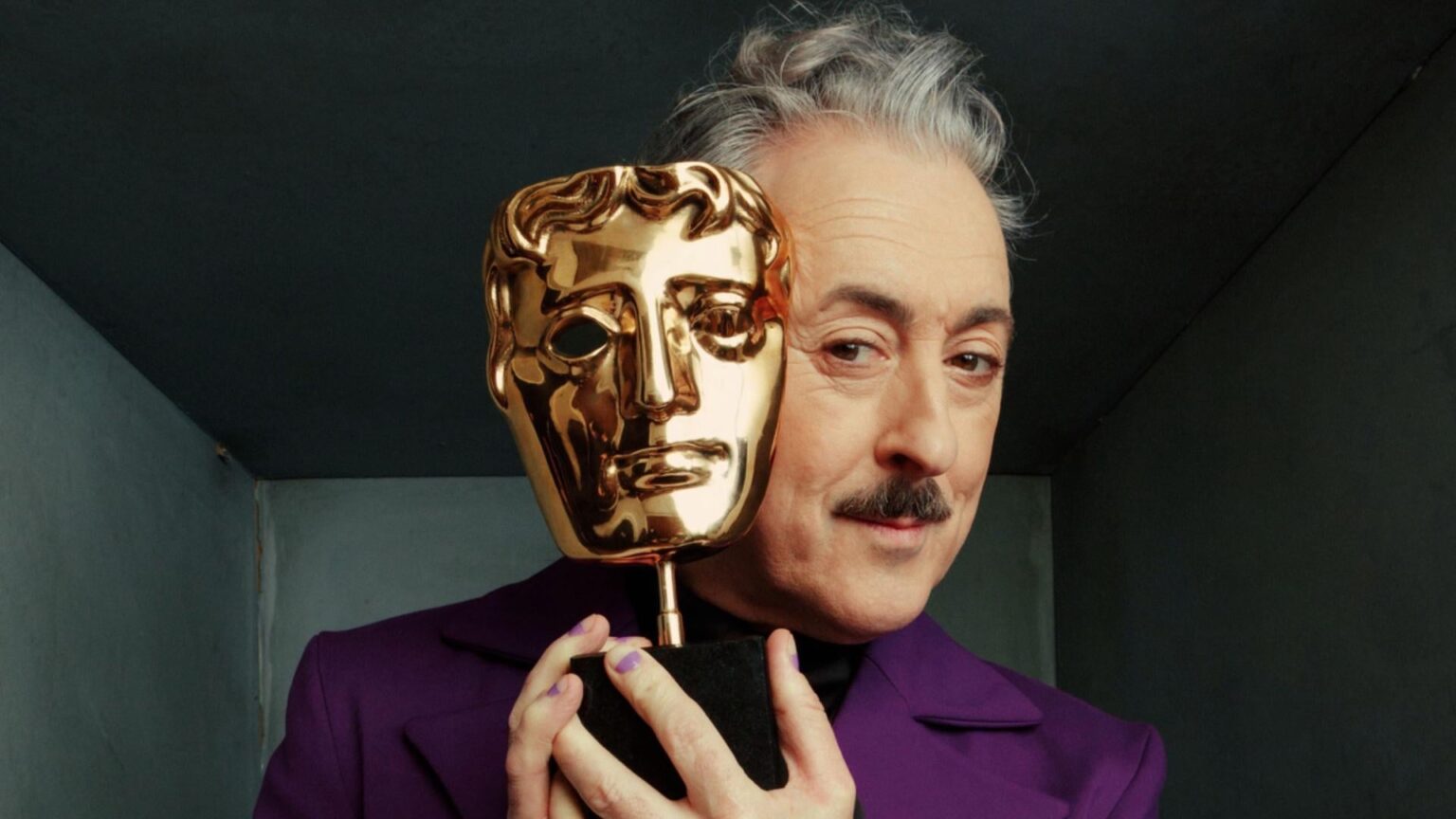 Tourette's activist John Davidson reveals that the BBC edited out multiple homophobic tics he made toward host Alan Cumming for the televised broadcast of the BAFTAs this weekend