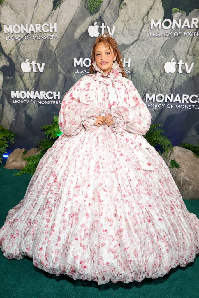 Kiersey Clemons attends the world premiere of Apple TV's “Monarch: Legacy of Monsters” Season 2, Kiersey Clemons, Viviano Fall 2025 gown, Viviano floral print dress, Viviano pink red floral gown, Monarch Legacy of Monsters Season 2 premiere, TCL Chinese Theatre LA, Apple TV Monarch premiere fashion, Kiersey Clemons red carpet style, Viviano Fall 2025 runway 