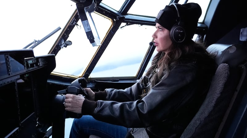 US Secretary of Homeland Security Kristi Noem helps fly an HC-130J during an aerial tour from US Coast Guard Air Station Kodiak on March 17, 2025, in Kodiak Station, Alaska.