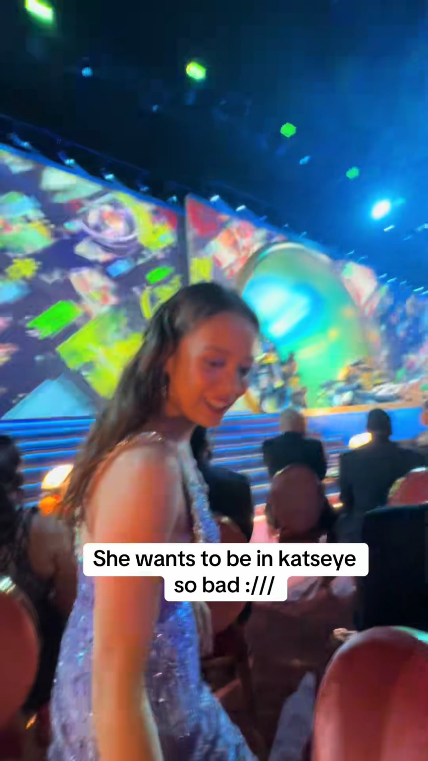 Katseye's Megan cheering on Katseye from the audience at the Grammys