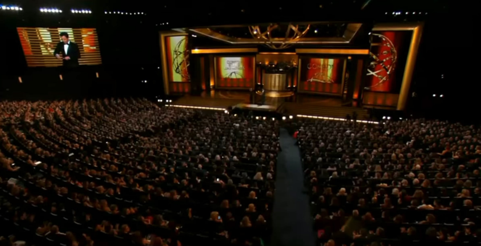 Bryan Cranston “congratulating” Julia Louis-Dreyfus on her win at the 2014 Primetime Emmy Awards.