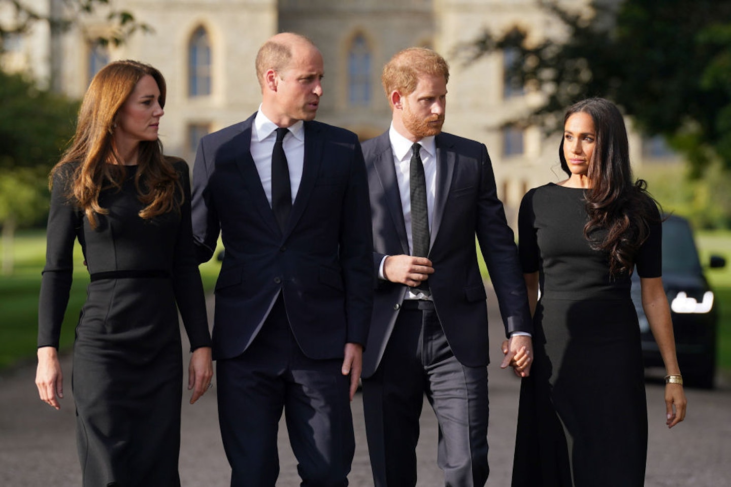 Catherine, Prince William, Prince Harry, and Meghan on the Long Walk at Windsor Castle in Windsor, England.