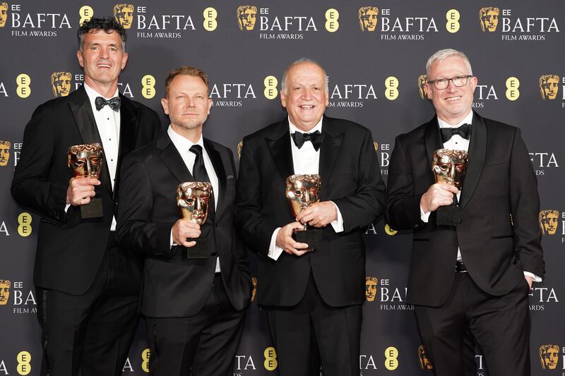 From left: Eric Saindon, Richard Baneham, Joe Letteri and Daniel Barrett pose with their awards after winning Best Special Visual Effects for Avatar: Fire And Ash. Photograph: Ian West/PA Wire