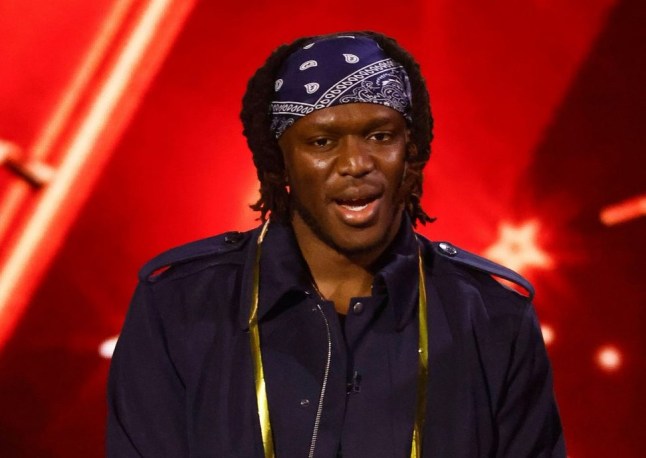 KSI in all black outfit to a red backdrop on Britain's Got Talent