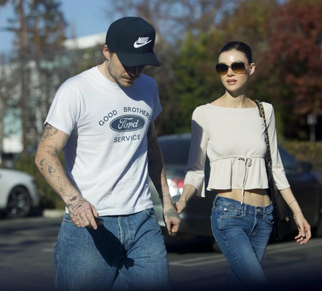 BGUK_3476903 - *PREMIUM-EXCLUSIVE* Los Angeles, MUST CALL FOR PRICING BEFORE USAGE - STRICTLY NOT AVAILABLE FOR ONLINE USAGE UNTIL 22:00 PM UK TIME ON 05/02/2026 - Brooklyn Beckham Debuts New Tattoos in Los Angeles, Covering David Beckham Tribute and Showcasing Nicola Peltz Commitment Amid Family Estrangement Brooklyn Beckham was spotted out in Los Angeles debuting new tattoos, including a dramatic update to his right-arm anchor design where he appears to have covered a tribute to his father, David Beckham, replacing the word ???Dad??? with symbolic markings. The 26-year-old also showed off bold new ink honouring his wife, Nicola Peltz Beckham, with her name written in a heavier font across his hand and surrounded by an all-over cloud motif. The eldest son of David and Victoria Beckham has publicly confirmed he is estranged from his family and does not wish to reconcile. In a candid Instagram post, he accused his parents of attempting to undermine his relationship with Nicola, saying distance has brought him peace and placing privacy and autonomy at the centre of an ongoing high-profile celebrity family feud. Brooklyn was wearing a T-shirt reading ???Good Brother