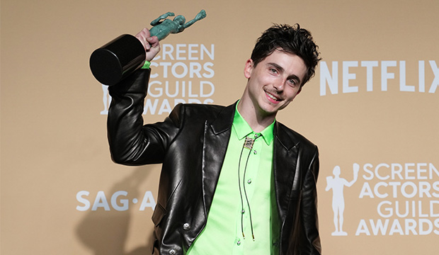 Timothée Chalamet poses in the press room with the award for Outstanding Performance by a Male Actor in a Leading Role in a Motion Picture for 