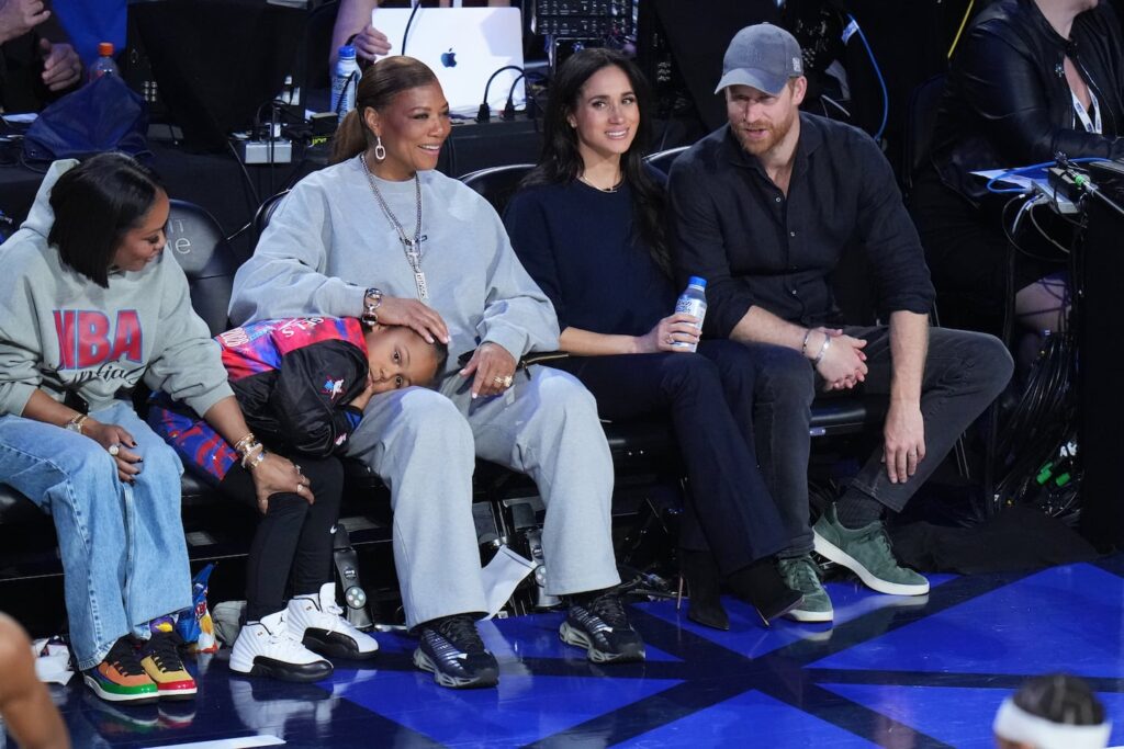 Queen Latifah, left, sits with Meghan Markle and Prince Harry during the NBA All-Star basketball game Sunday, Feb. 15, 2026, in Inglewood, Calif.