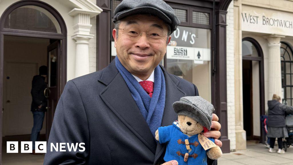 Japanese ambassador spends day as a Peaky Blinder. Suzuki - and Paddington - were dressed like characters from the show and took a tour which included watching traditional chain-making.