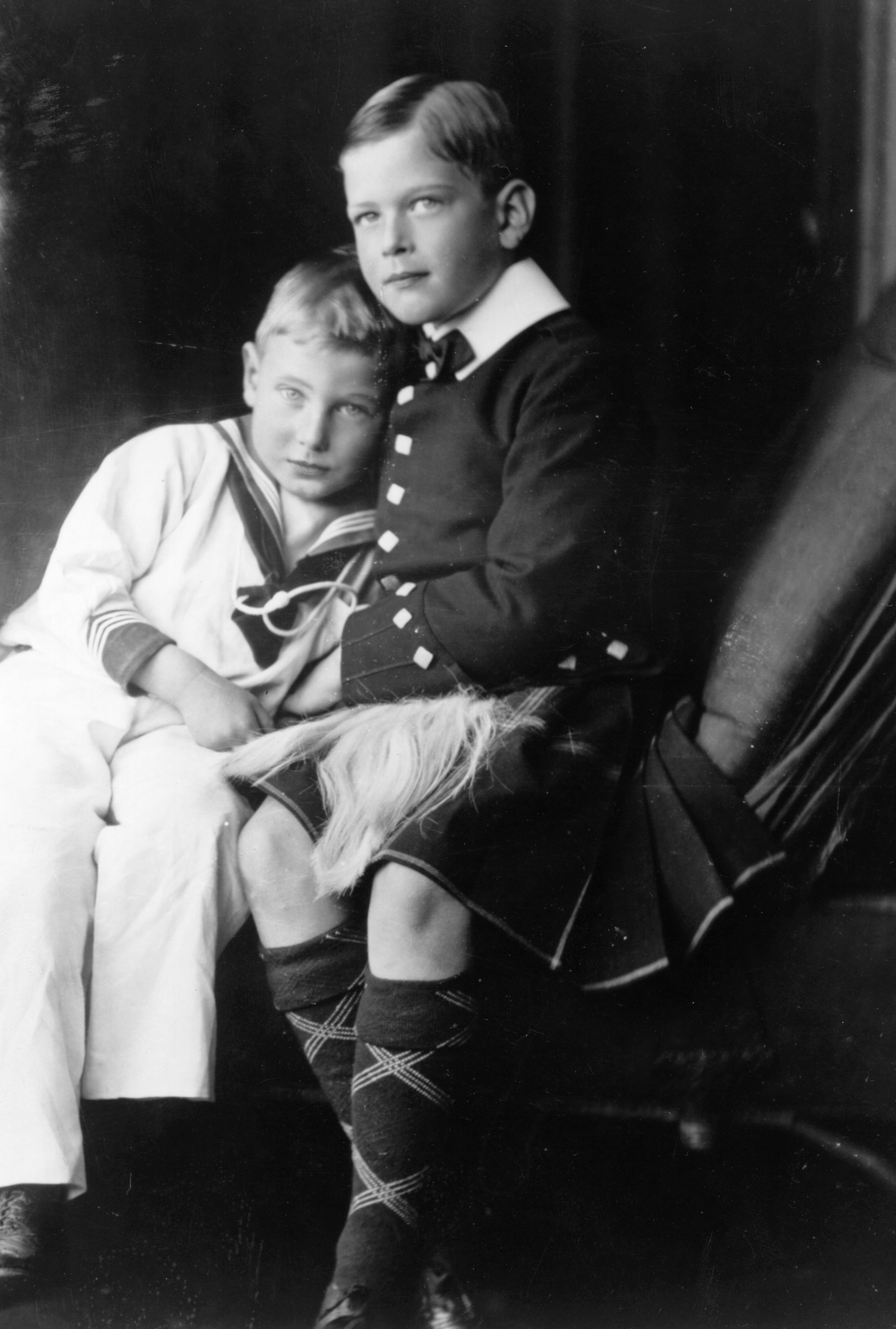 Prince John wearing a sailor suit sitting with Prince George Duke of Kent