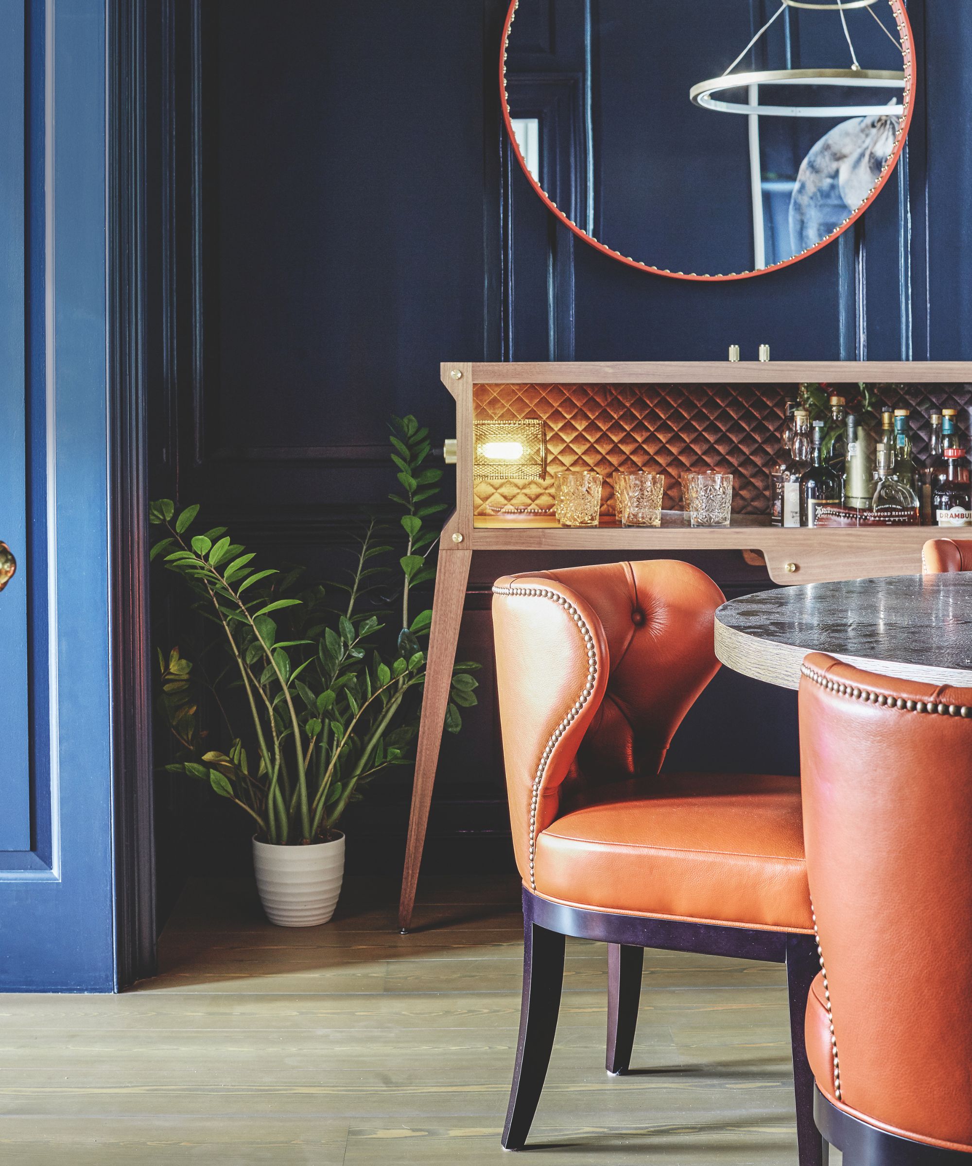 Leather dining chair in navy room