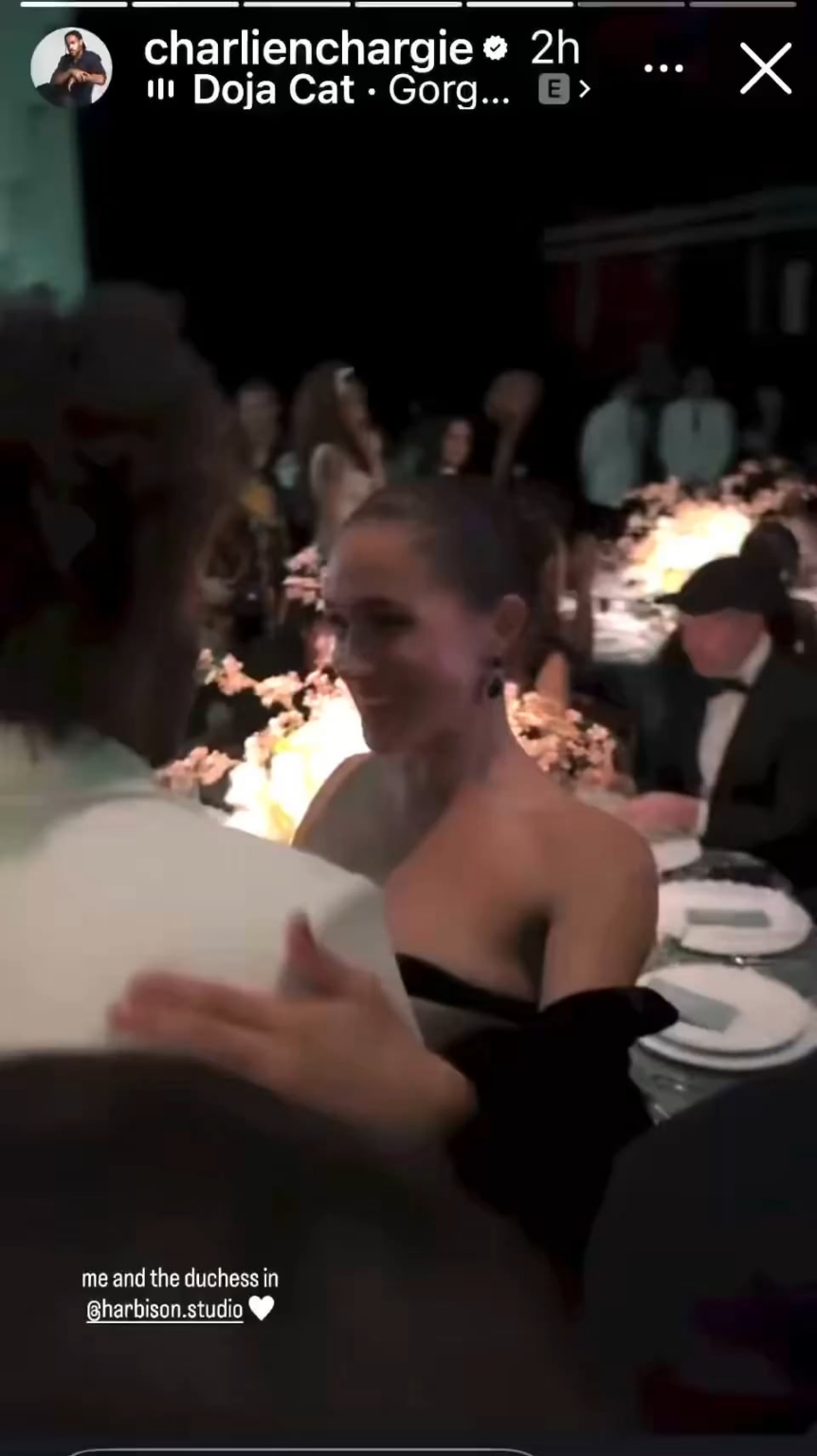 Meghan chatting with the designer of her dress, Charles Harbison of Harbison Studio, on theme for the evening!