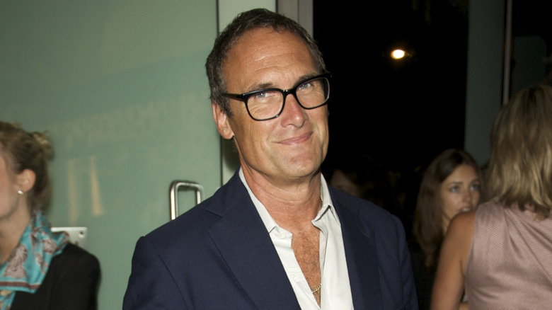 Food critic AA Gill smiling for cameras at publicity event