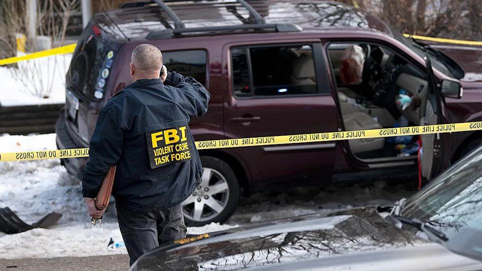 A crashed car at the scene where an ICE agent shot Renee Good.