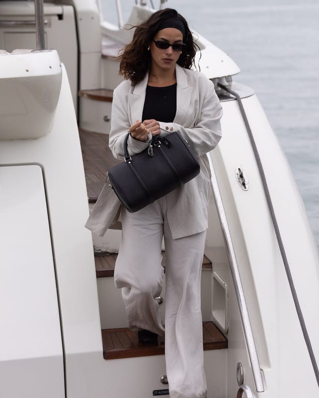 person disembarking from a yacht