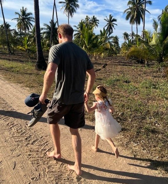 Lilibet looked adoreable in her tulle dress, as she held hands with her dad, Prince Harry