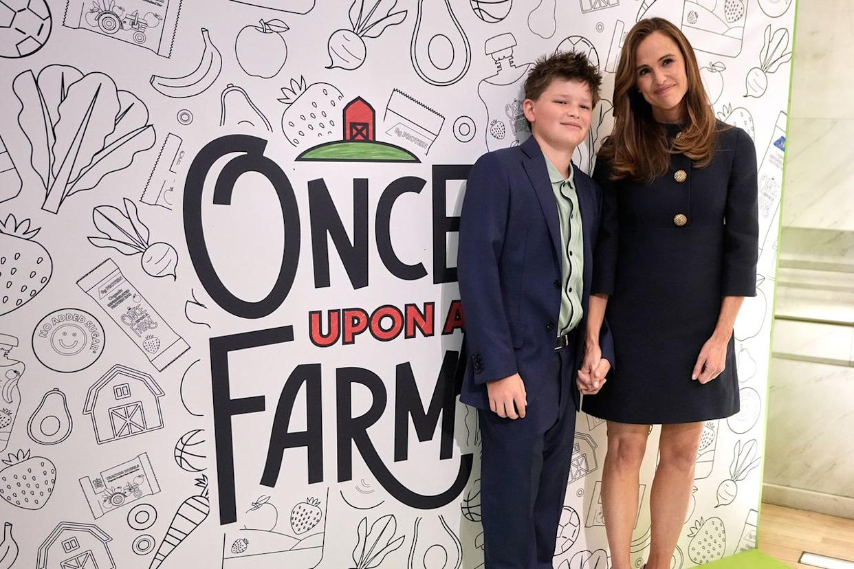 Once Upon a Farm co-founder Jennifer Garner and son Sam Affleck walk on the floor of the New York Stock Exchange prior to the company's IPO, Friday, Feb. 6, 2026. AP Photo/Richard Drew