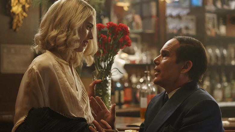 Margaret Qualley as Elizabeth Weiland speaking with Ethan Hawke as Lorenz Hart in Blue Moon