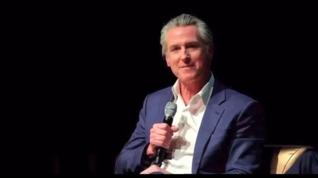 Gavin Newsom in conversation with Mayor Andre Dickens addresses the Atlanta crowd: “I’m like you…I’m a 960 SAT guy. I can’t read.”
