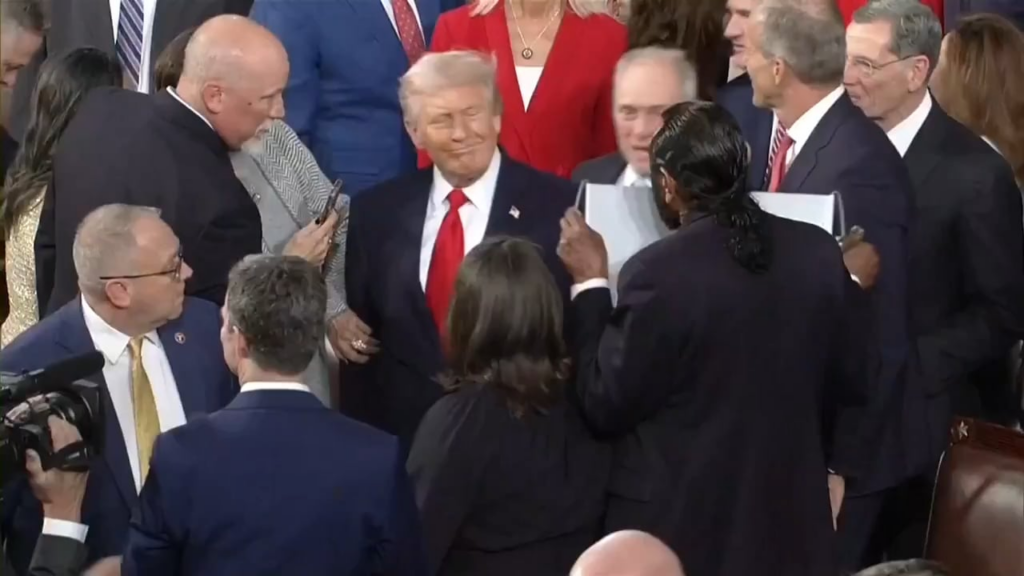 Rep. Al Green holding up a sign that said “Black people are not apes” before Steve Scalise pulled it down Rep. Al Green holding up a sign that said "Black people are not apes” before Steve Scalise pulled it down