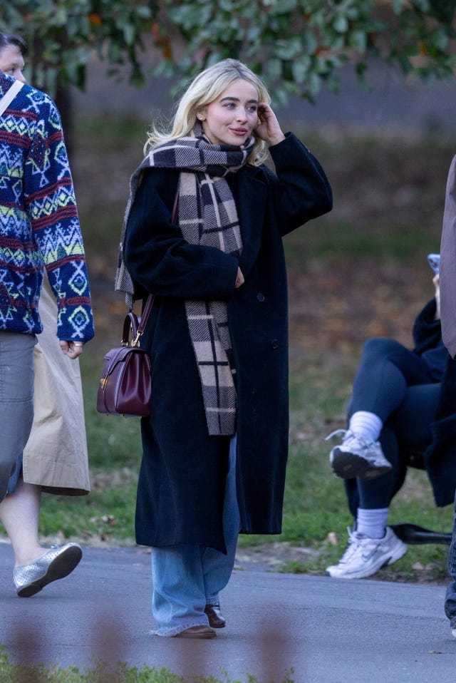 *exclusive* new york, ny sabrina carpenter was seen bundled up against the brisk brooklyn air during a laid back afternoon in prospect park with friends. sabrina kept warm in a babaton by aritzia coat and a checked guest in residence scarf, pairing the look with light wash denim and a burgundy celine “16” bag. the singer is currently in town for her sold out madison square garden shows and appeared relaxed as she enjoyed her day off surrounded by autumn leaves.pictured: sabrina carpenterbackgrid usa 28 october 2025 usa: +1 310 798 9111 / usasales@backgrid.comuk: +44 208 344 2007 / uksales@backgrid.com*uk clients pictures containing childrenplease pixelate face prior to publication*